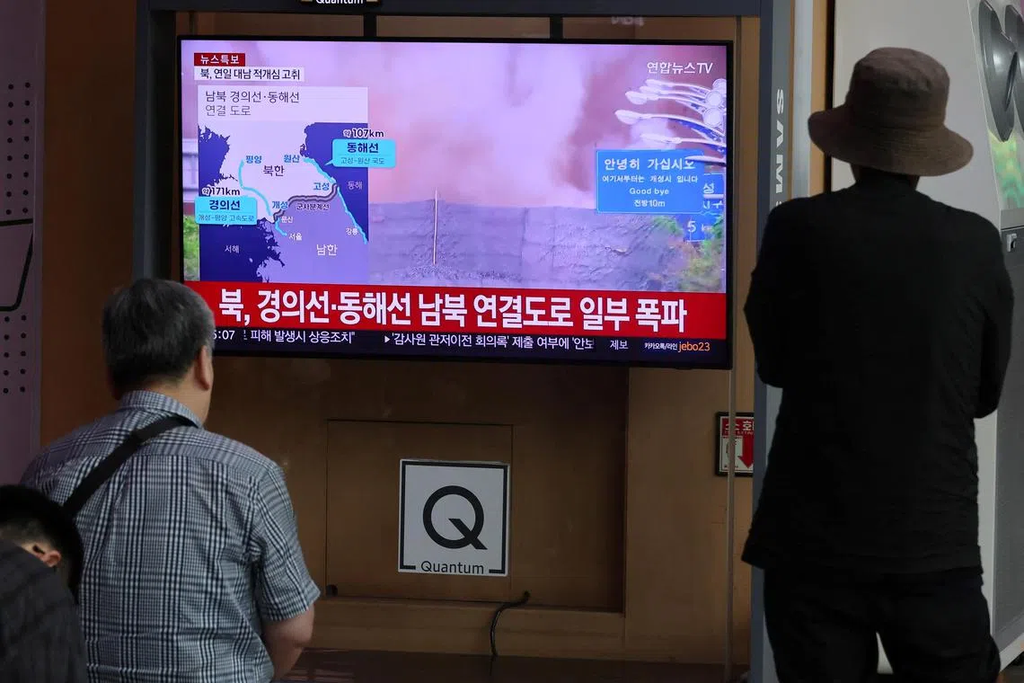 People watch a TV broadcasting a news report on North Korea blowing up sections of inter-Korean roads and rail lines on its side of the heavily fortified border between the two Koreas, at a railway station in Seoul, South Korea,  October 15, 2024. Yonhap via REUTERS THIS IMAGE HAS BEEN SUPPLIED BY A THIRD PARTY. NO RESALES. NO ARCHIVES. SOUTH KOREA OUT. NO COMMERCIAL OR EDITORIAL SALES IN SOUTH KOREA.