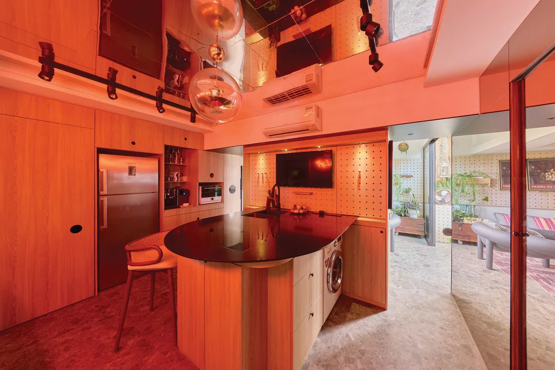 The quartz-topped island can seat up to eight people for meals.