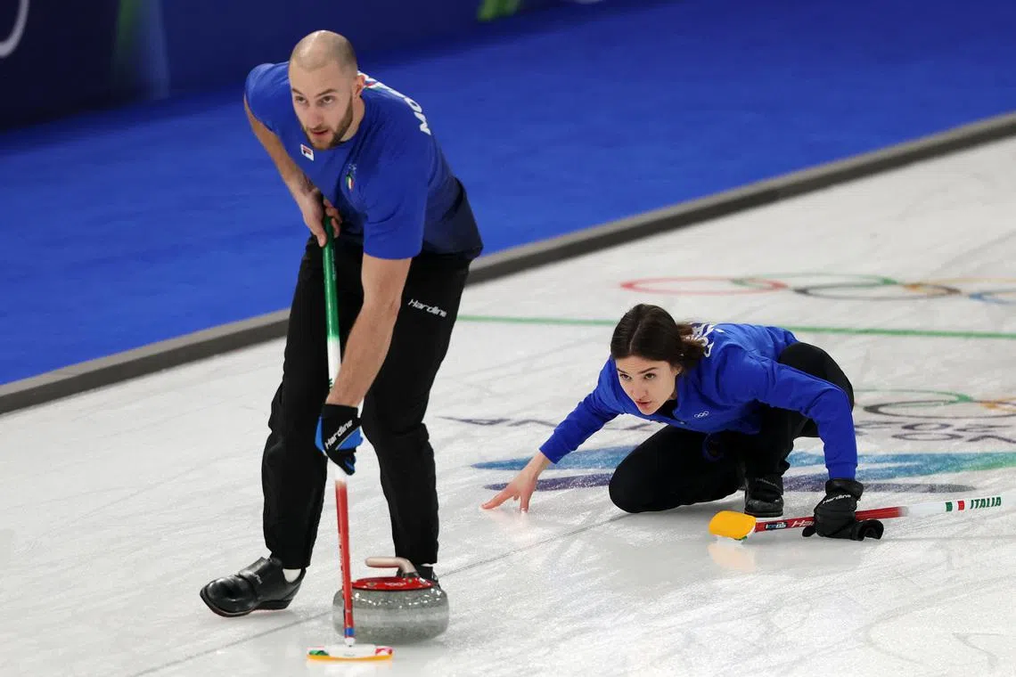 Curling-Italy and US win to boost playoff hopes, Britain's perfect streak ends