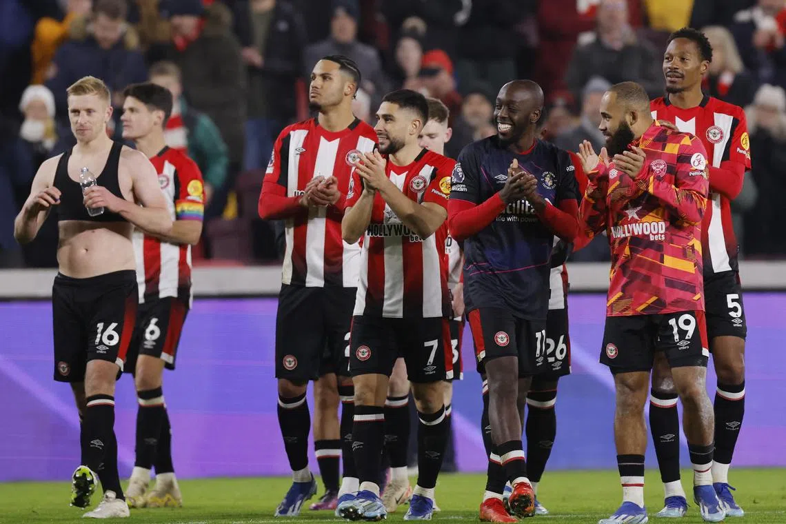 Brentford players celebrating following an English Premier League win over Luton Town.