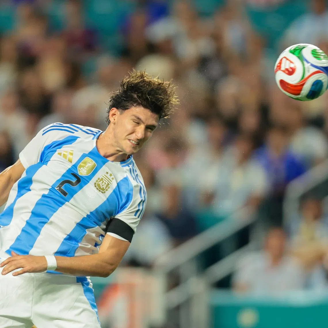 Oct 10, 2025; Miami Gardens, Florida, USA; Argentina defender Leonardo Balerdi (2) hits a header against Venezuela during the second half at Hard Rock Stadium. Mandatory Credit: Sam Navarro-Imagn Images