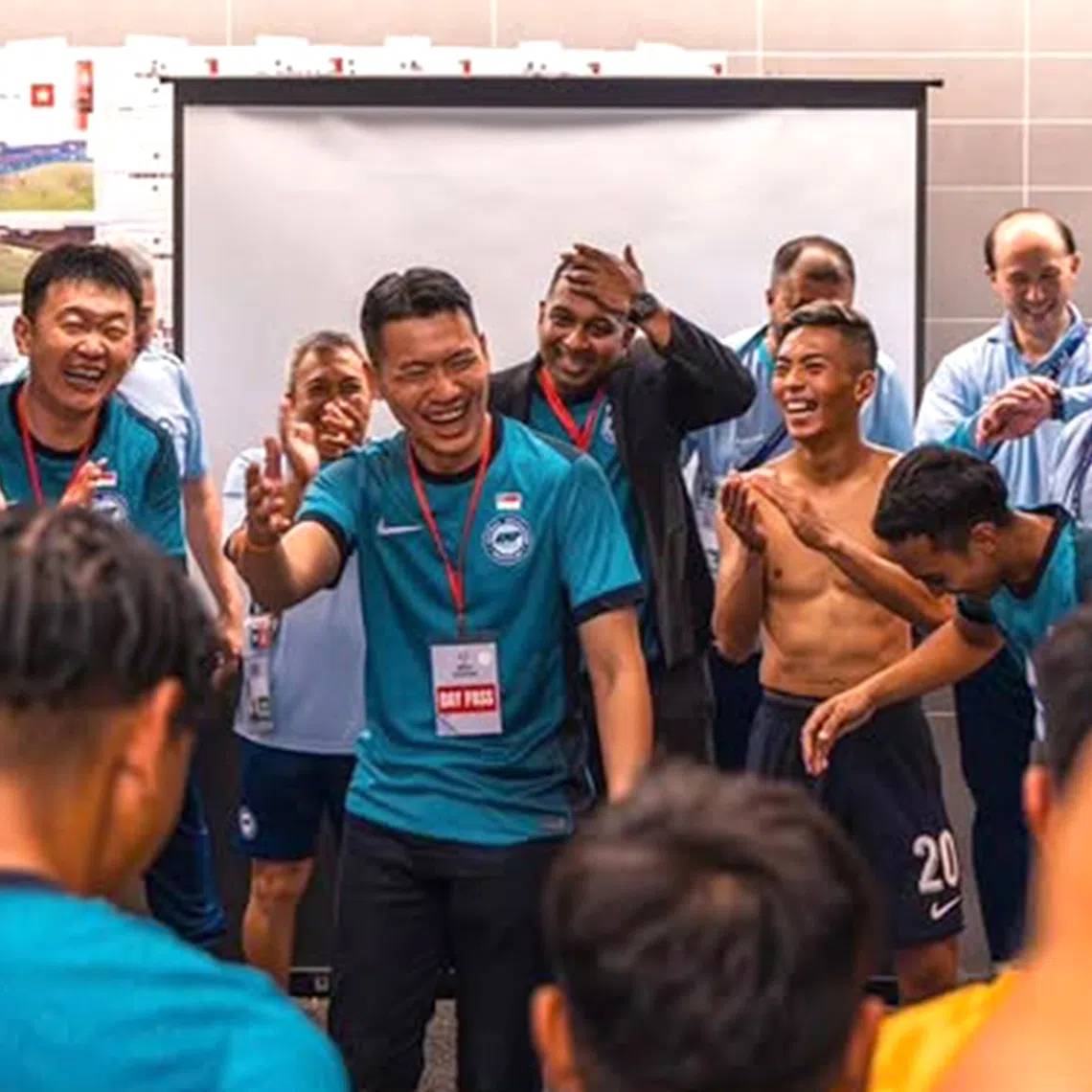 Acting Minister for Culture, Community and Youth David Neo addressing Singapore's national football team following their 2-1 away win over Hong Kong on Nov 18.