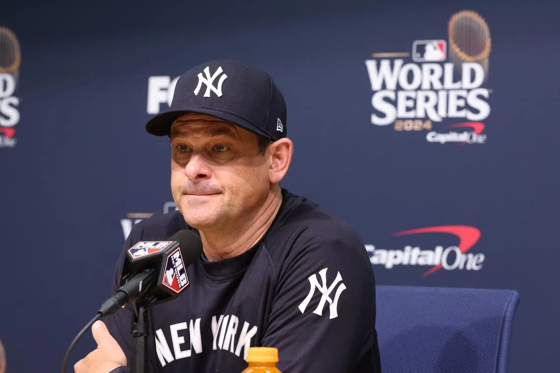 FILE PHOTO: Oct 25, 2024; Los Angeles, California, USA; New York Yankees manager Aaron Boone (17) talks with the media before the game against the Los Angeles Dodgers during game one of the 2024 MLB World Series at Dodger Stadium. Mandatory Credit:  Kiyoshi Mio-Imagn Images/File Photo