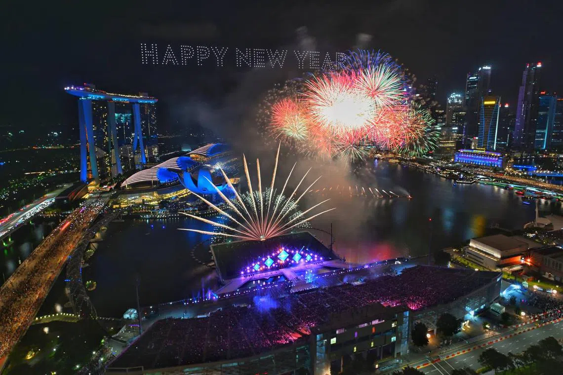 Fireworks explode in Marina Bay to welcome in 2023.