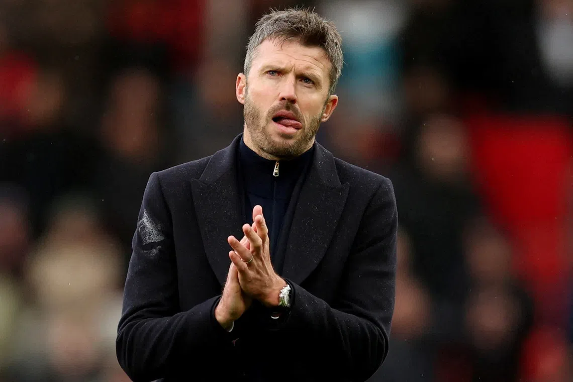 Manchester United manager Michael Carrick looks dejected as he applauds fans after his side’s 3-0 home defeat to Bournemouth on Oct 25.