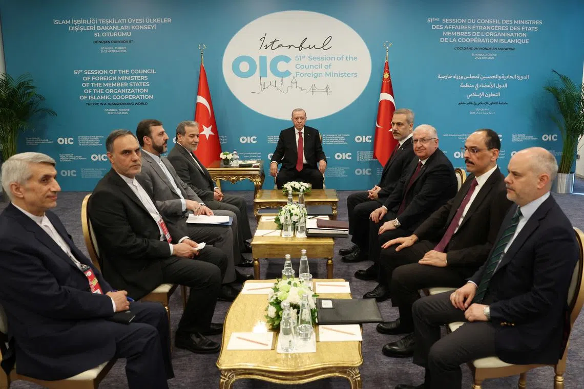 FILE PHOTO: Turkey's President Tayyip Erdogan meets with Iranian Foreign Minister Abbas Araghchi as they are flanked by Turkish Foreign Minister Hakan Fidan and members of Turkish and Iranian delegations, during the 51st Session of the Council of Foreign Ministers of the Organisation of Islamic Cooperation (OIC), in Istanbul, Turkey, June 21, 2025. Murat Cetinmuhurdar/PPO/Handout via REUTERS/File Photo