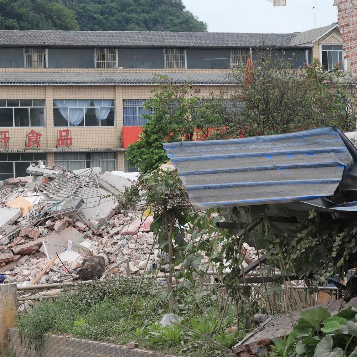 Guangxi was struck by two magnitude 5.2 earthquakes on May 18, and at least nine people died in the south-western region of China after a pickup truck fell into a flooded river amid heavy rain.