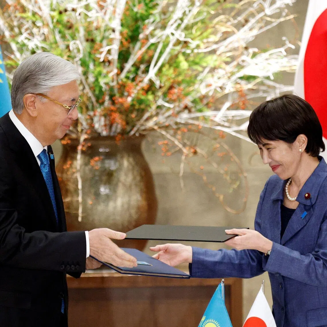 Japanese Prime Minister Sanae Takaichi (right) and Kazakhstan's President Kassym-Jomart Tokayev exchange partnership joint statements at the prime minister’s official residence in Tokyo on Dec 18, 2025.