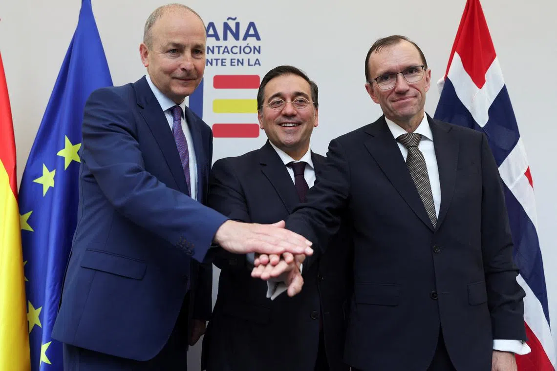 Spanish Foreign Minister Jose Manuel Albares, Norway's Foreign Minister Espen Barth Eide and Ireland's Foreign Minister Micheal Martin gesture after a press conference in Brussels, Belgium May 27, 2024.REUTERS/Johanna Geron