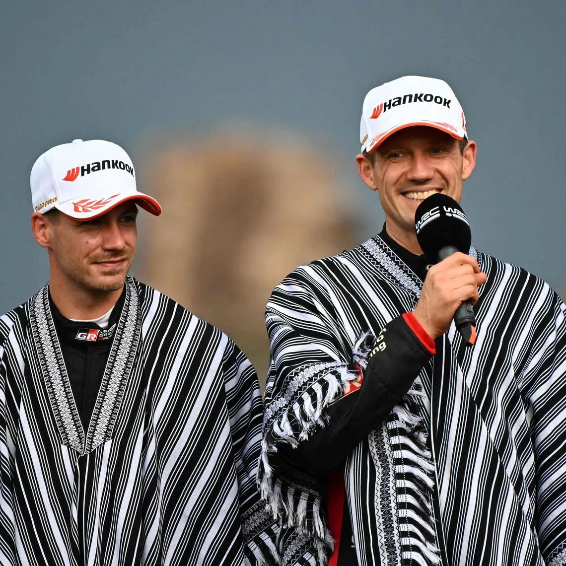 Frenchman Sebastien Ogier speaks next to Toyota co-driver Vincent Landais after winning the WRC Rally Paraguay, 10th stage of the FIA World Rally Championship, at the Ruins of Trinidad, Itapua department, Paraguay on Aug 31, 2025.