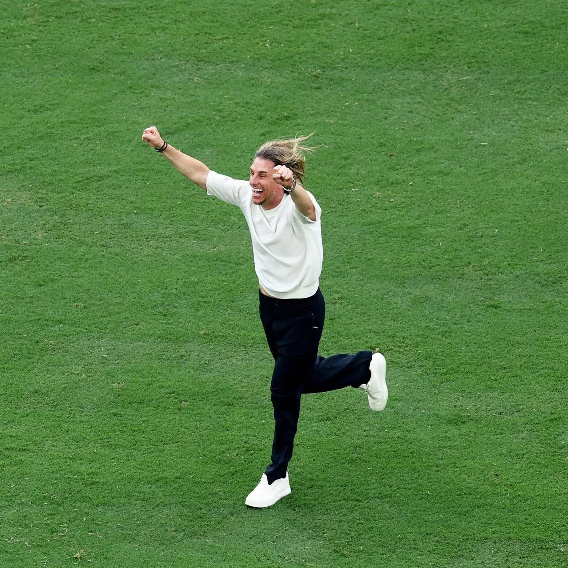 Ecuador coach Sebastian Beccacece celebrating after their 2-1 victory against Germany on June 25.