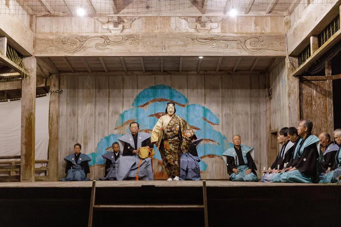 Shinobu Kamiyama, center, plays the tormented ghost of a famously beautiful woman in the play “Tamakazura” at Ushio Shrine on Sado Island, Japan, June 12, 2025. Noh, a form of drama once performed for the entertainment of medieval warriors, and one of the world’s oldest surviving types of theater, is embraced and preserved by the remote islanders of Sado. (Ko Sasaki/The New York Times)