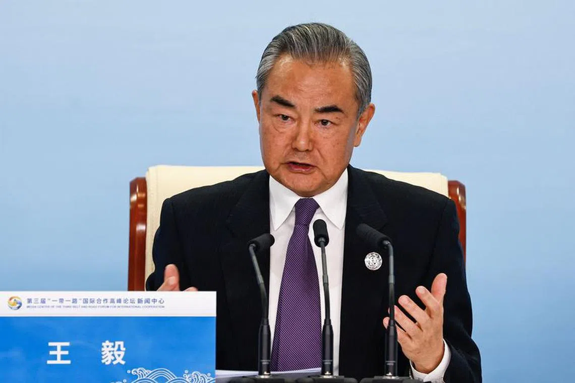 Chinese Foreign Minister Wang Yi speaks at a press conference on the sidelines of the Third Belt and Road Forum (BRF), at the media centre in Beijing, China October 18, 2023. REUTERS/Tingshu Wang/File Photo