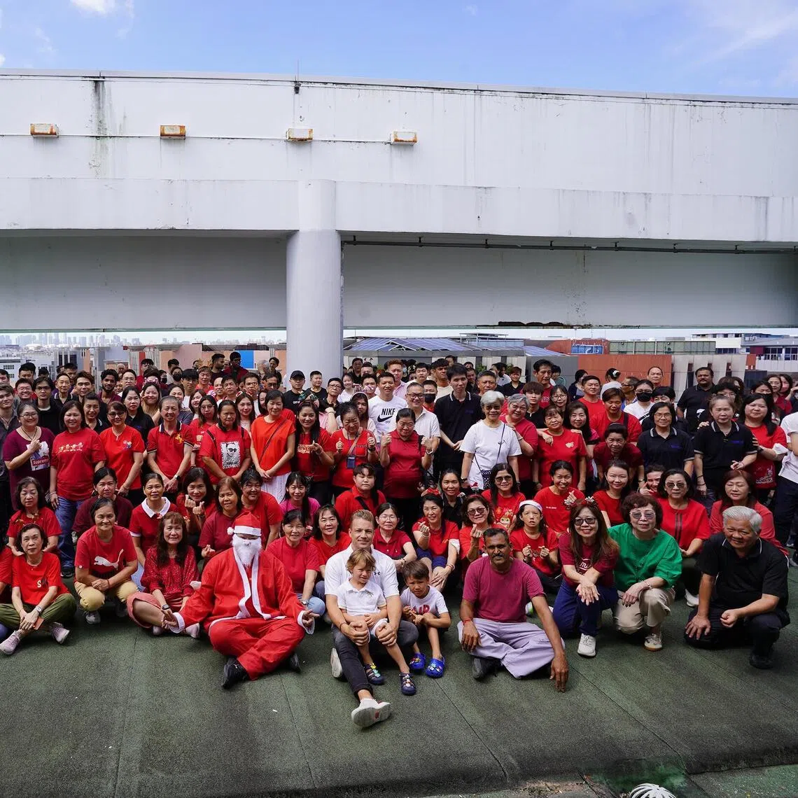 MatSing’s executive vice-president Michael Matytsine (front row, in white) with Singapore staff at the company’s base in Kaki Bukit during a Christmas event.