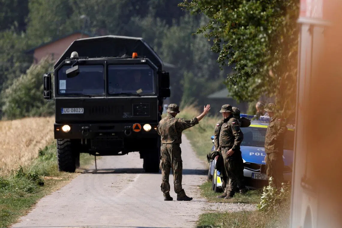 Soldiers stand guard near the site a Russian drone is believed to have fallen after intrusions into Polish airspace, in Czesniki, Poland September 10, 2025.  Agencja Wyborcza.pl/Patryk Ogorzalek/via REUTERS