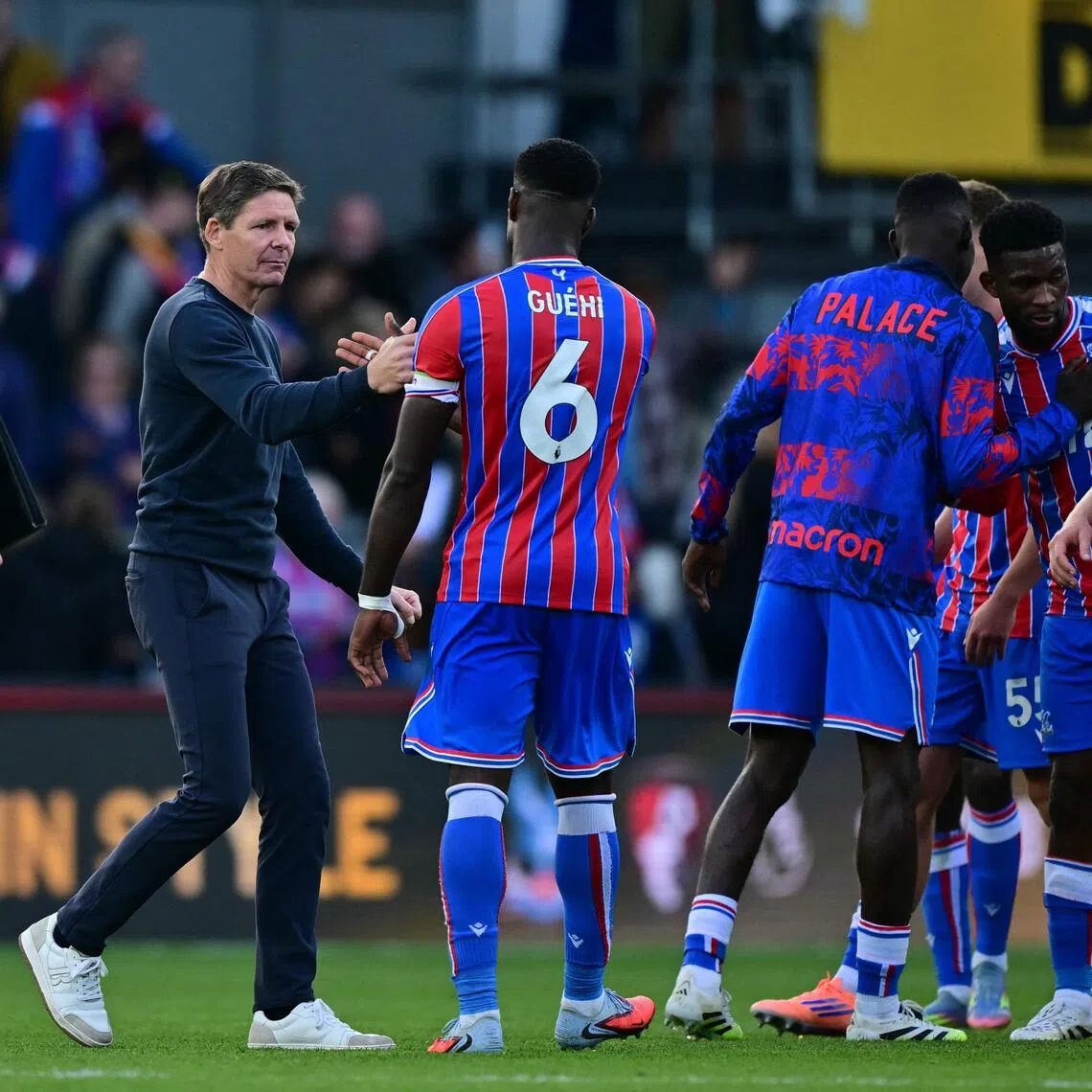 Crystal Palace manager Oliver Glasner congratulates his players after the win over Liverpool.