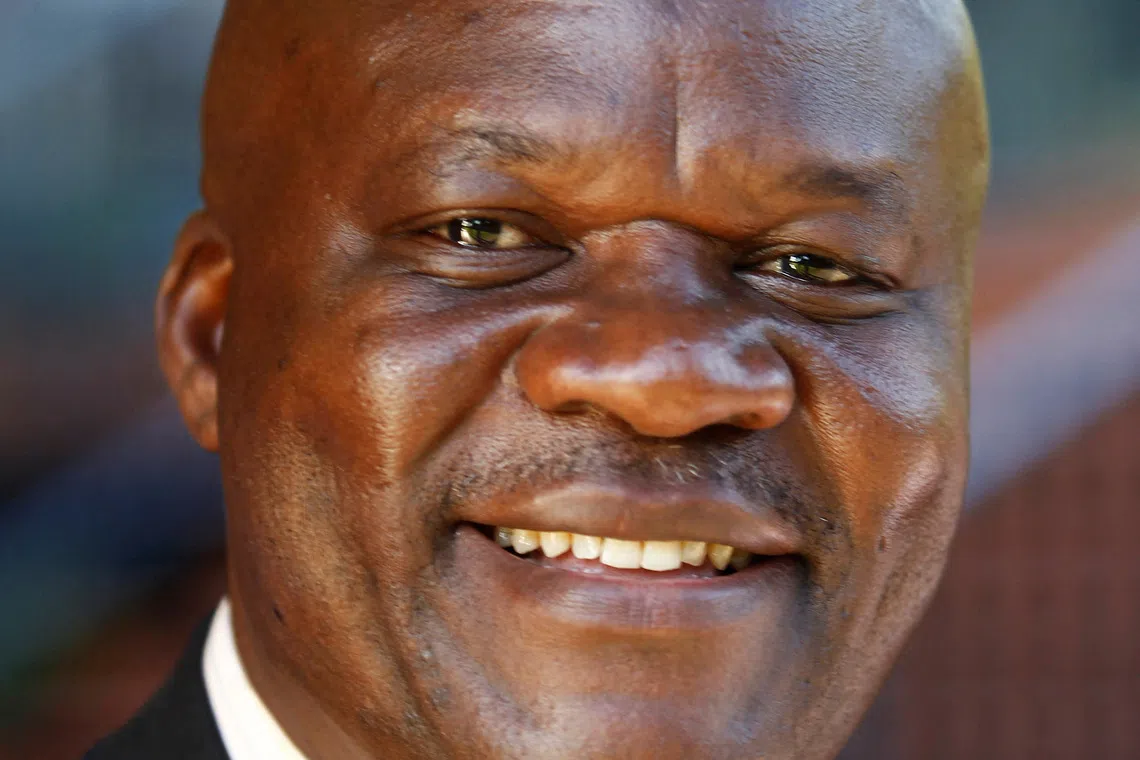 FILE PHOTO: Roger Lumbala, a former member of parliament in the Democratic Republic of Congo who joined the M23 rebel group, attends a peace talk meeting in Uganda's capital Kampala January 11, 2013, as the second round of peace negotiations resume between the M23 rebels and Congolese government.  REUTERS/James Akena/File Photo