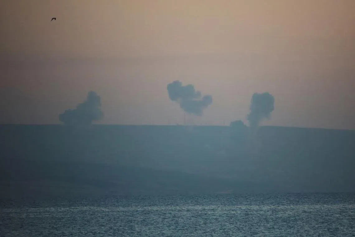 FILE PHOTO: Smoke rises on the Lebanese side near the border with Israel, amid ongoing cross-border hostilities between Hezbollah and Israeli forces, as seen from Tyre, southern Lebanon December 2, 2023. REUTERS/Aziz Taher/File photo