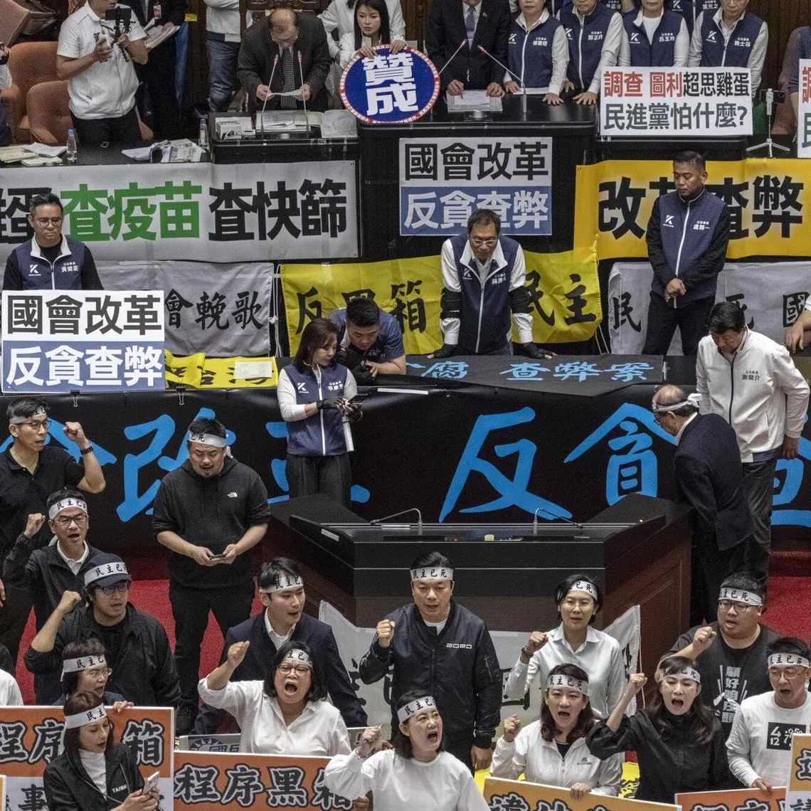 Democratic Progressive Party (DPP) lawmakers protest at the Legislative Yuan in Taipei on May 24, 2024.