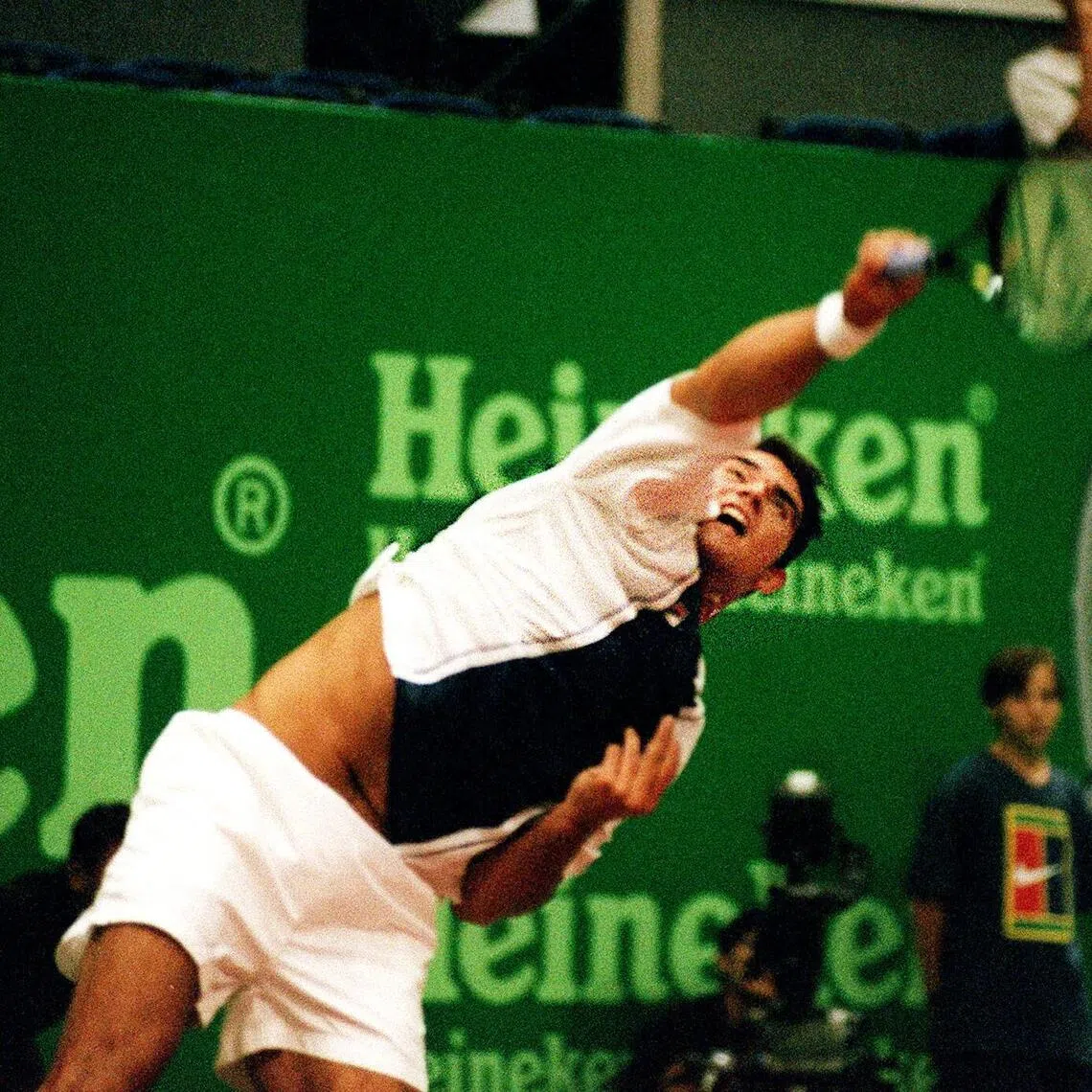 Mark Philippoussis playing in Singapore in 1999, the year that he rose to his highest ranking of world No. 8.