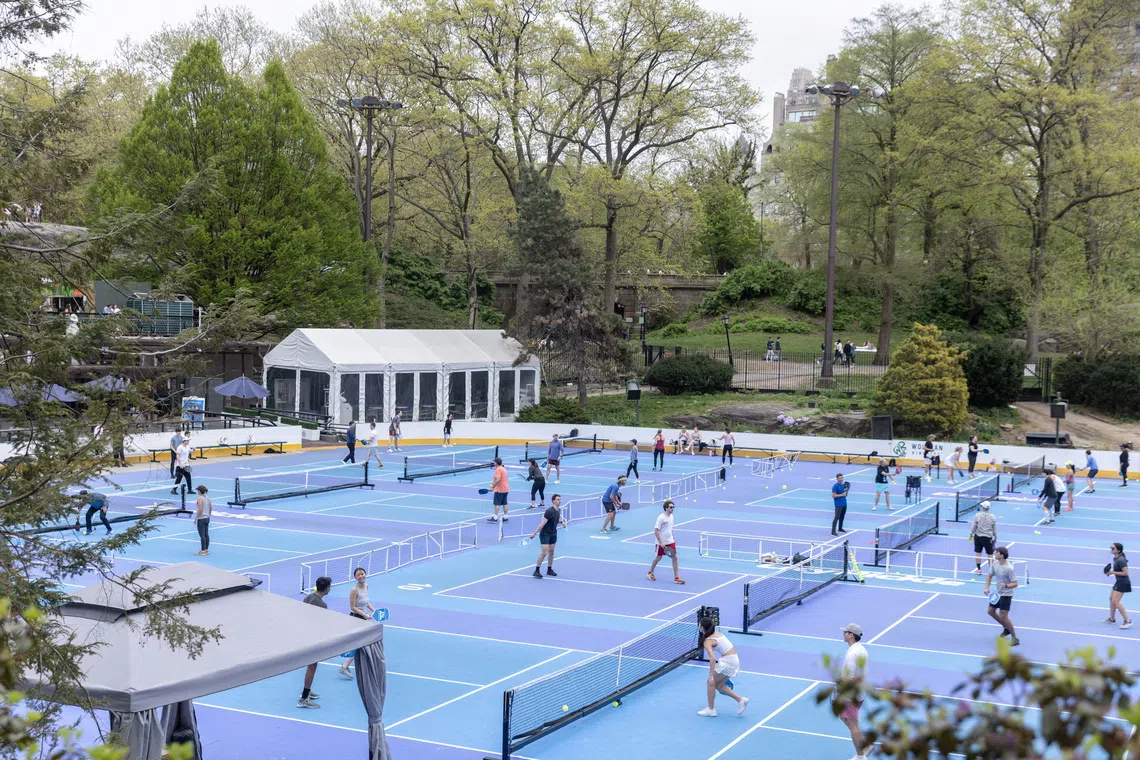 People play pickleball at Central Park in New York, U.S., April 15, 2023. REUTERS/Jeenah Moon