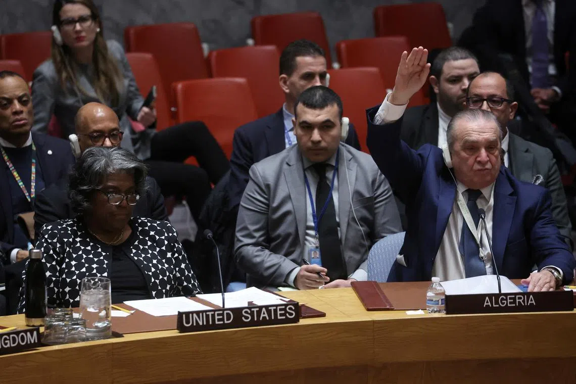 Algeria’s UN Ambassador Amar Bendjama votes in favour as US Ambassador Linda Thomas-Greenfield vetos a vote on a UN. Security Council resolution to demand an immediate humanitarian ceasefire in Gaza.