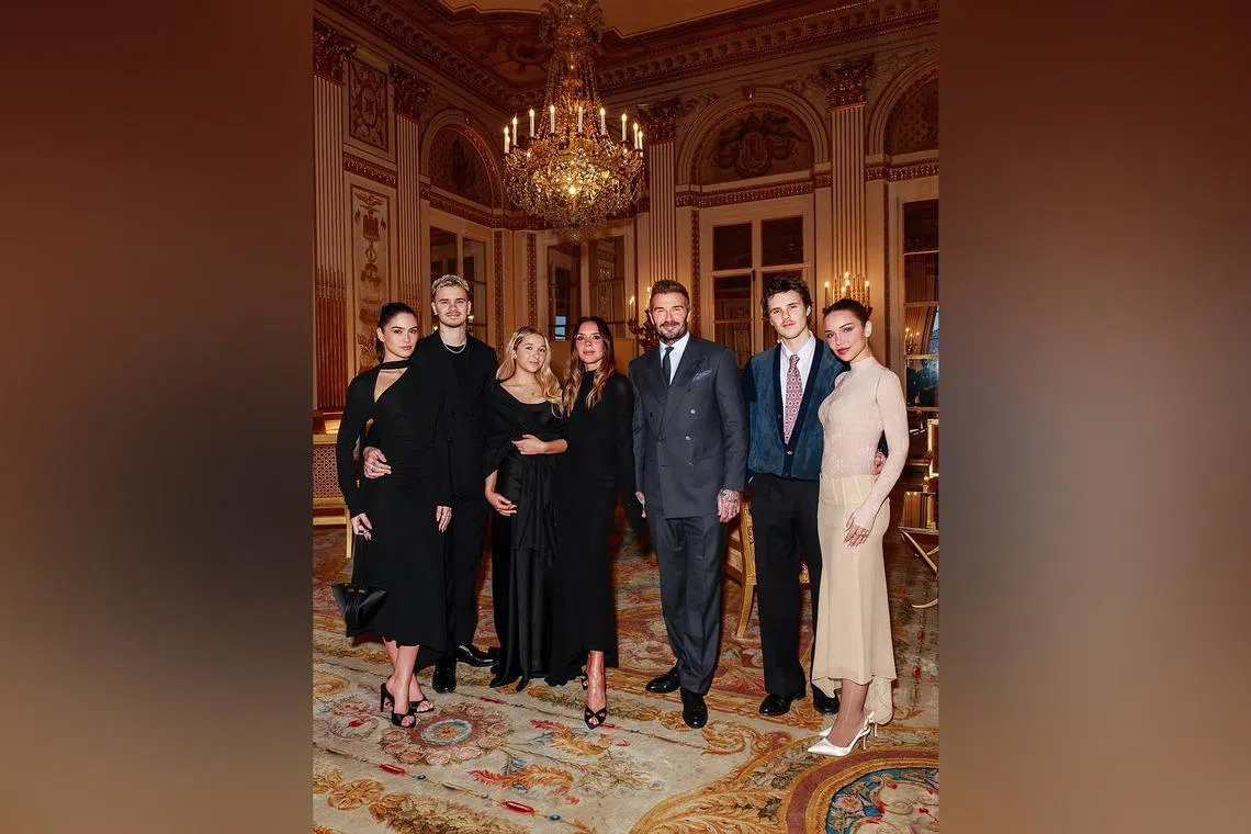 (From left) Kim Turnbull, Romeo Beckham, Harper Beckham, Victoria Beckham, David Beckham, Cruz Beckham and Jackie Apostel at the Paris ceremony where Victoria was named an Officer of the Order of the Arts and Letters. 