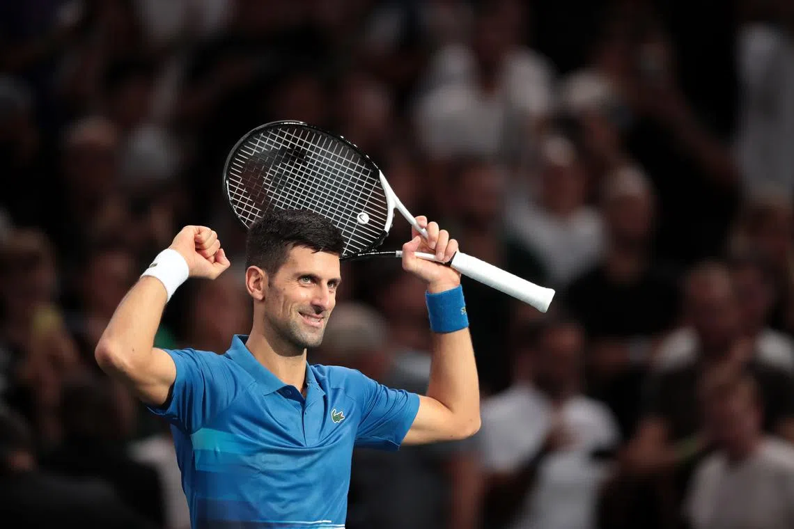 Novak Djokovic celebrates after winning his match against Maxime Cressy of the US.