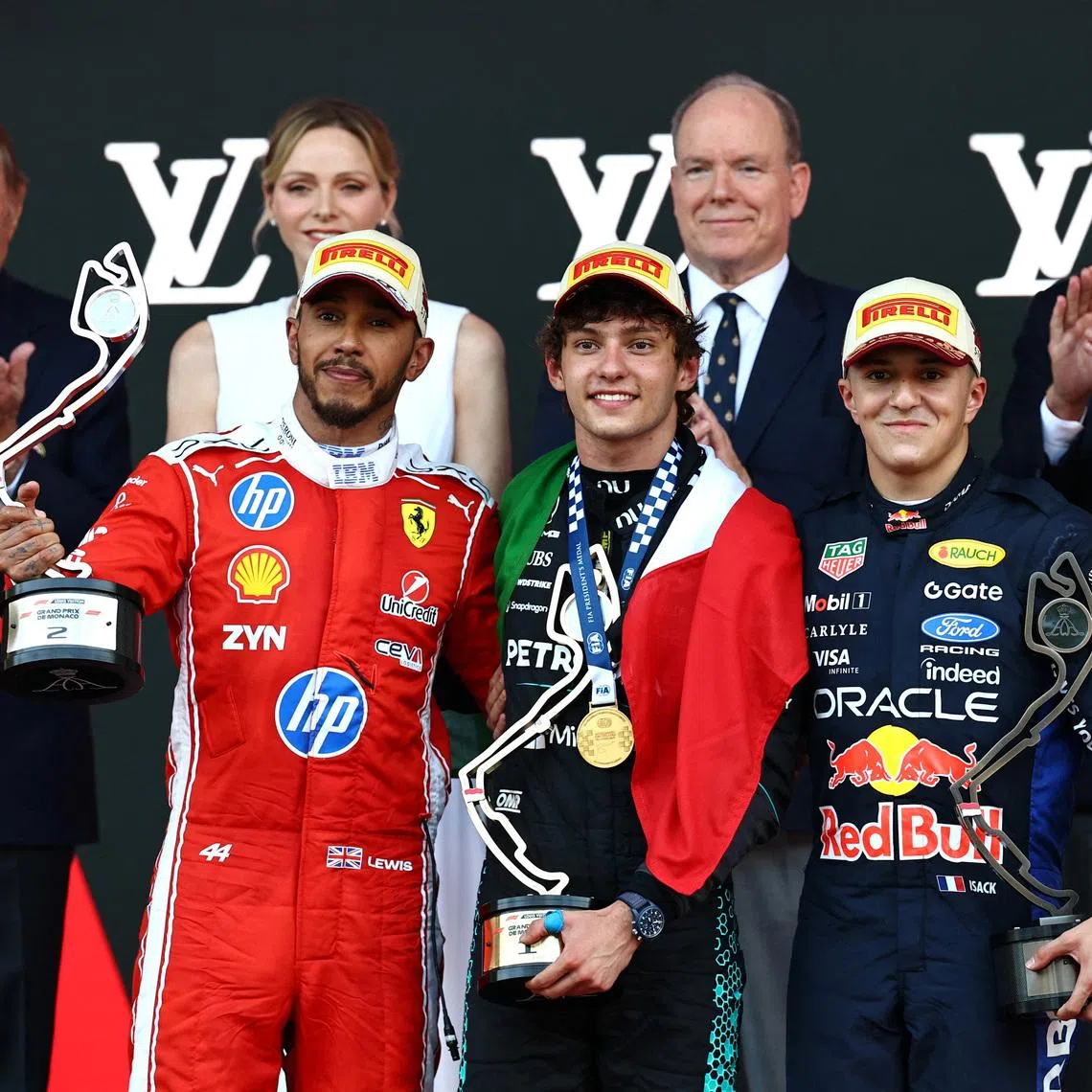 Formula One F1 - Monaco Grand Prix - Circuit de Monaco, Monaco - June 7, 2026 Mercedes' Andrea Kimi Antonelli celebrates on the podium after winning the Monaco Grand Prix alongside second placed Ferrari's Lewis Hamilton and third placed Red Bull's Isack Hadjar REUTERS/Manon Cruz