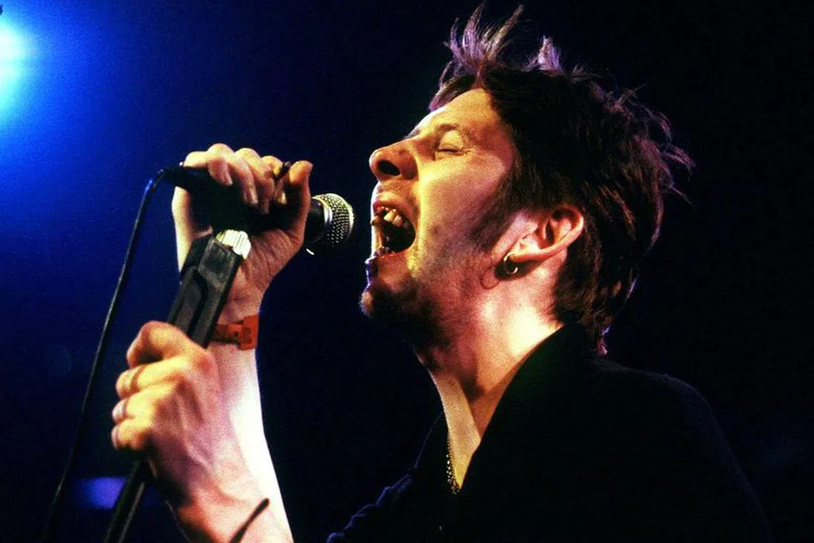 FILE PHOTO: Shane MacGowan, former lead singer of The Pogues, performs during the Montreux Jazz festival in the [Miles Davis] Hall late July 15, 1995. MacGowan and his band The Popes were part of the 'Irish Night' during the festival. REUTERS/Stringer/File Photo
