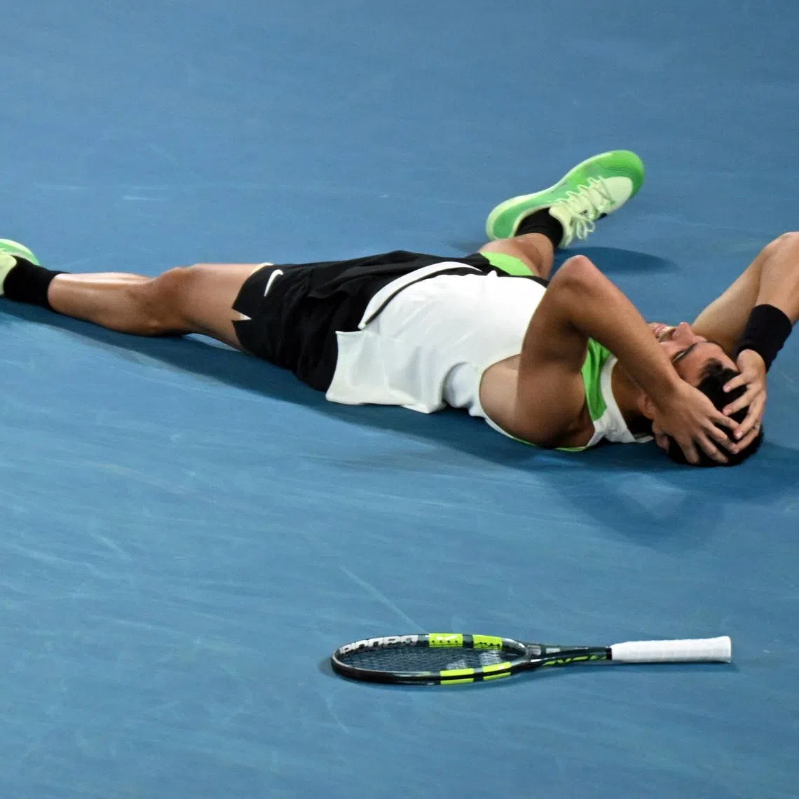 Tennis - Australian Open - Melbourne Park, Melbourne, Australia - February 1, 2026 Spain's Carlos Alcaraz celebrates after winning the Australian Open men's singles against Serbia's Novak Djokovic. Alcaraz becomes the youngest man to win all four grand slam titles. REUTERS/Jaimi Joy