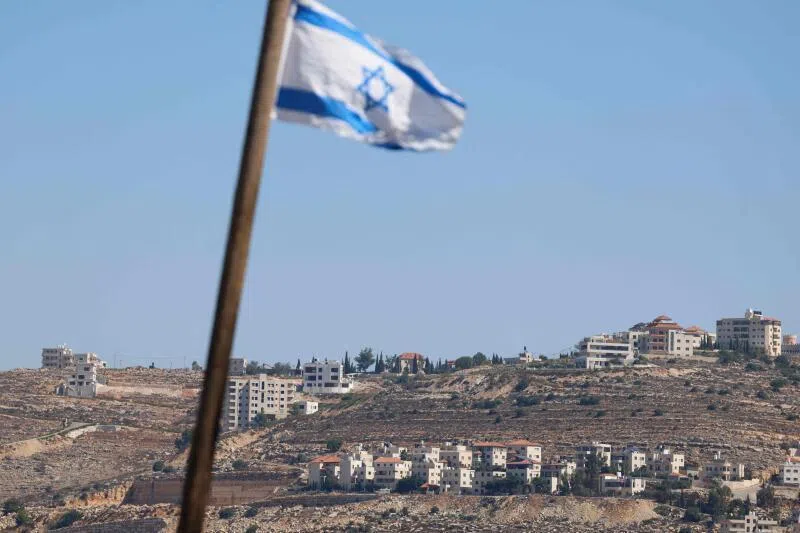 An Israeli flag installed by settlers seen in the al-Tireh neighbourhood at the western entrance to Ramallah, in the Israeli-occupied West Bank.