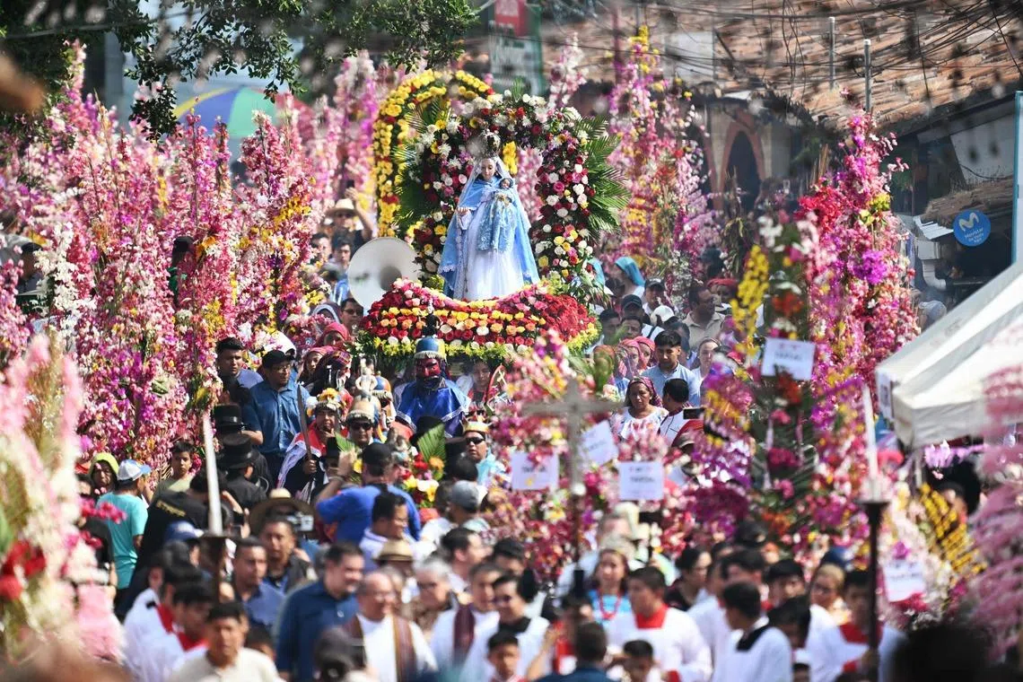 Faithfuls attending the celebration of the Brotherhood of Flowers and Palms in the indigenous town of Panchimalco, El Salvador on May 10, 2026. 