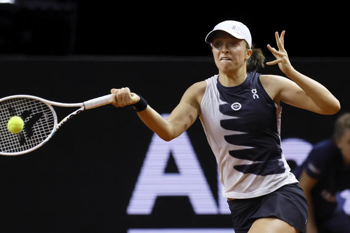Iga Swiatek of Poland in action during her final match against Aryna Sabalenka of Belarus at the Porsche Tennis Grand Prix tournament in Stuttgart, Germany.