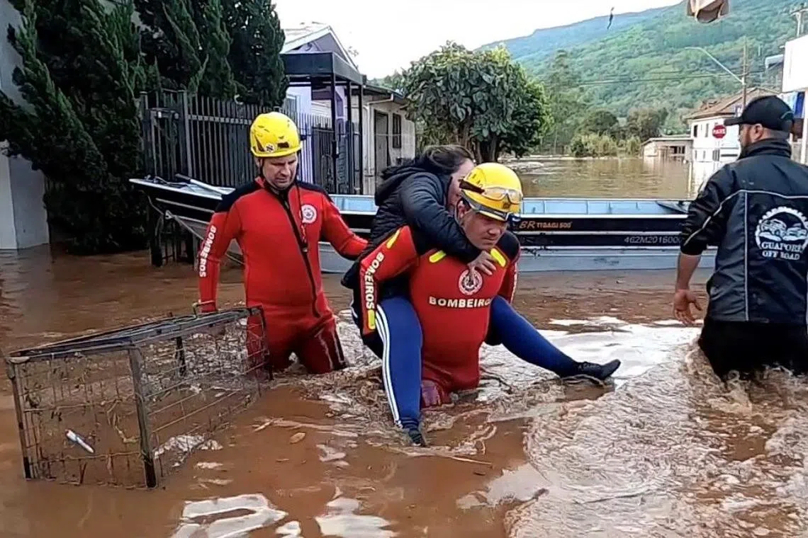Rescuers in action after an extratropical cyclone hit southern cities, in Mucum, Rio Grande do Sul state, Brazil, on Sept 6.