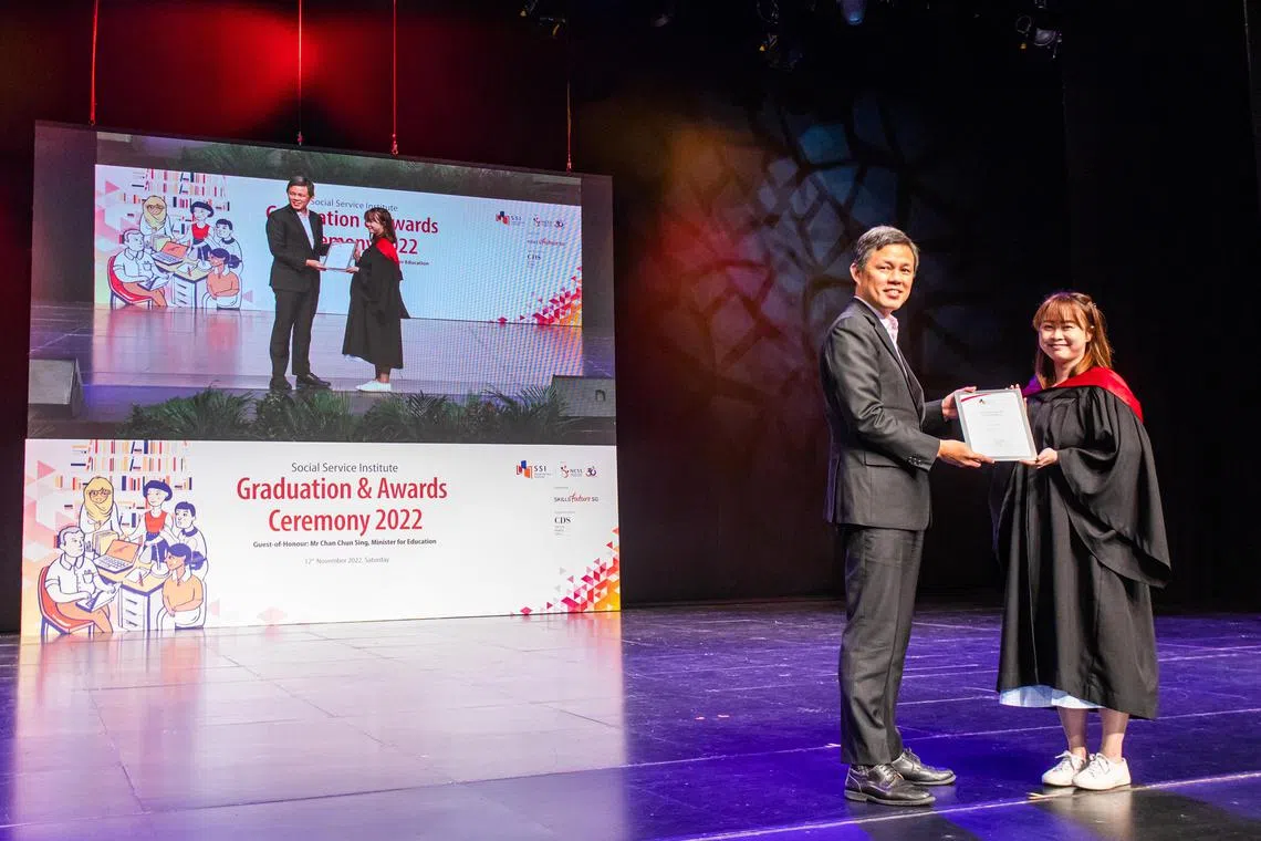Education Minister Chan Chun Sing and Ms Ong Peiyu, recipient of WSQ Diploma in Social Service, at the Social Service Institute’s graduation and awards ceremony at The Theatre at Mediacorp on Nov 12 
