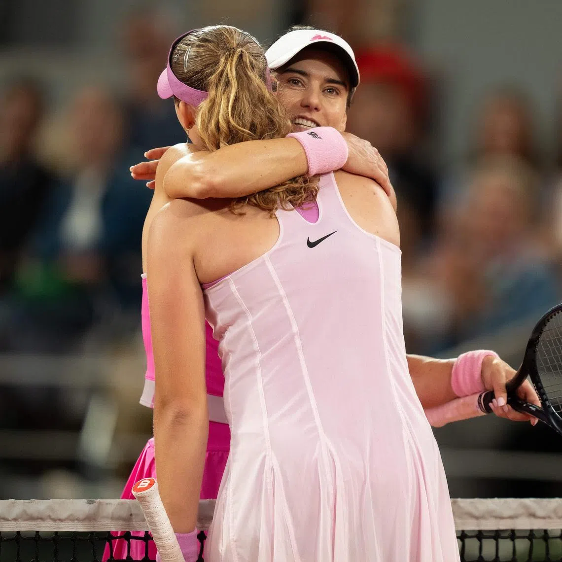 Jun 2, 2026; Paris, France; Mirra Andreeva at the net with Sorana Cirstea of Romania after their match on day 10 at Stade Roland Garros. Mandatory Credit: Susan Mullane-Imagn Images
