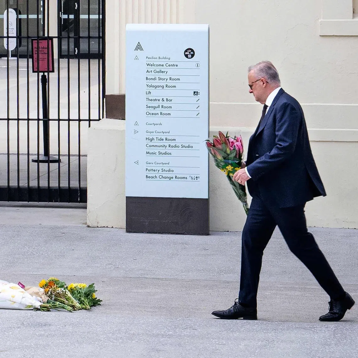 Australia's Prime Minister Anthony Albanese laying flowers at the scene of the country's deadliest mass shooting in nearly three decades, in Bondi Beach on Jan 8.