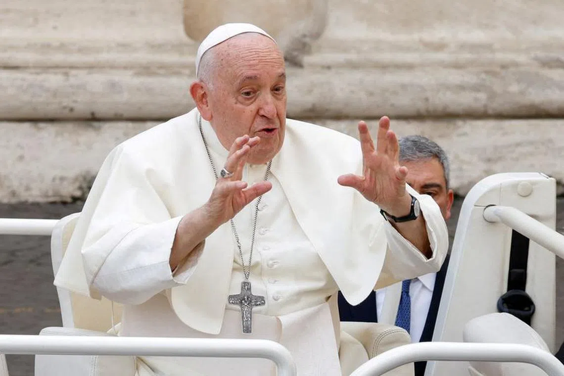 FILE PHOTO: Pope Francis gestures as he leaves after the weekly general audience, in Saint Peter's Square at the Vatican, November 15, 2023. REUTERS/Remo Casilli/File Photo