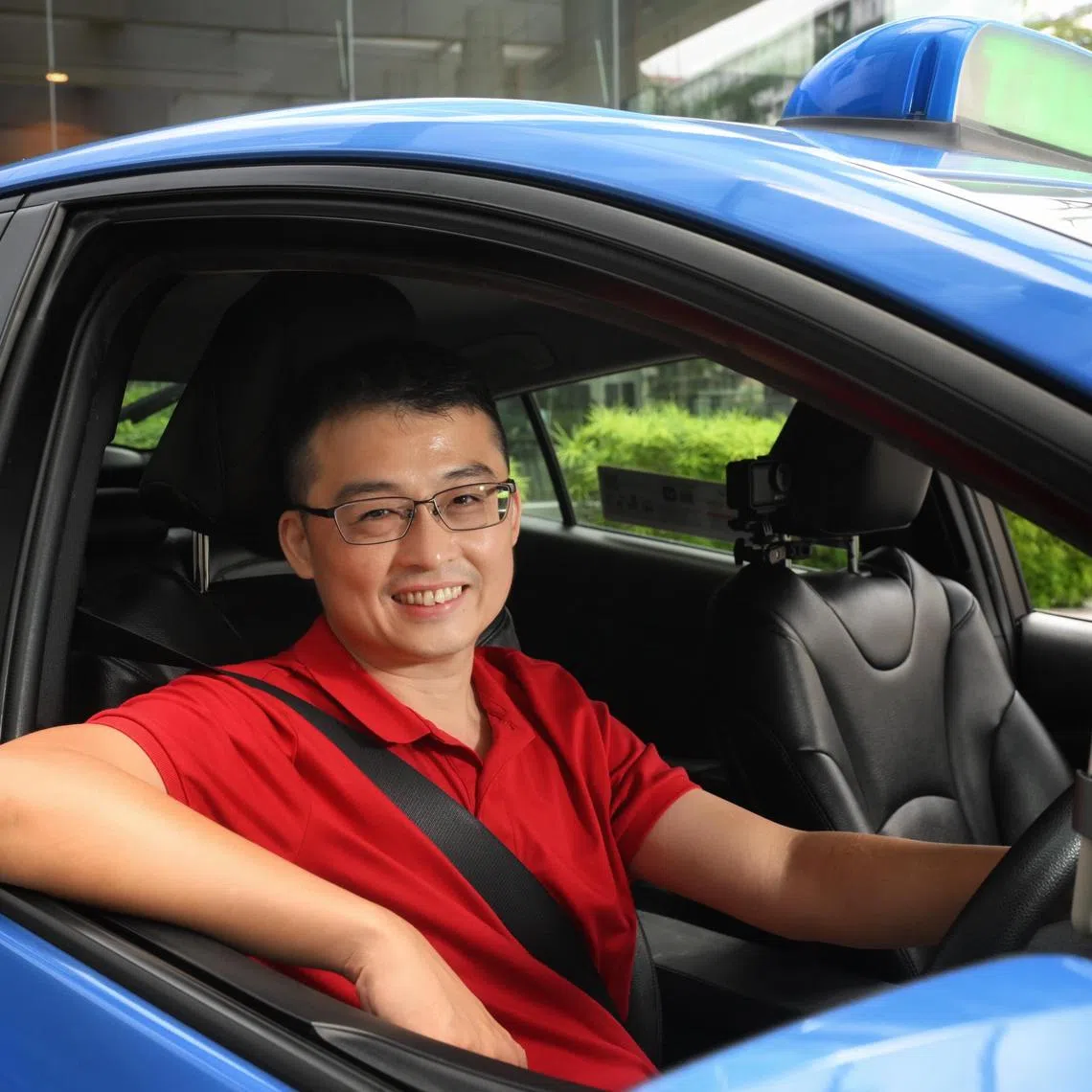 Vlogger and taxi driver Edward Jui (LazyCabbie) in his taxi on July 11, 2025.