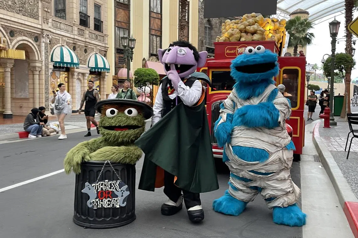 Oscar the Grouch, Count von Count and Cookie Monster from Sesame Street are ready for Halloween. 
