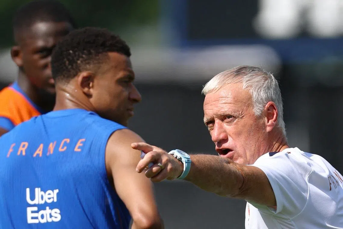 Soccer Football - FIFA World Cup 2026 - France Training - Bentley University, Waltham, Massachusetts, U.S. - June 12, 2026  France coach Didier Deschamps and Kylian Mbappe during training REUTERS/Peter Cziborra