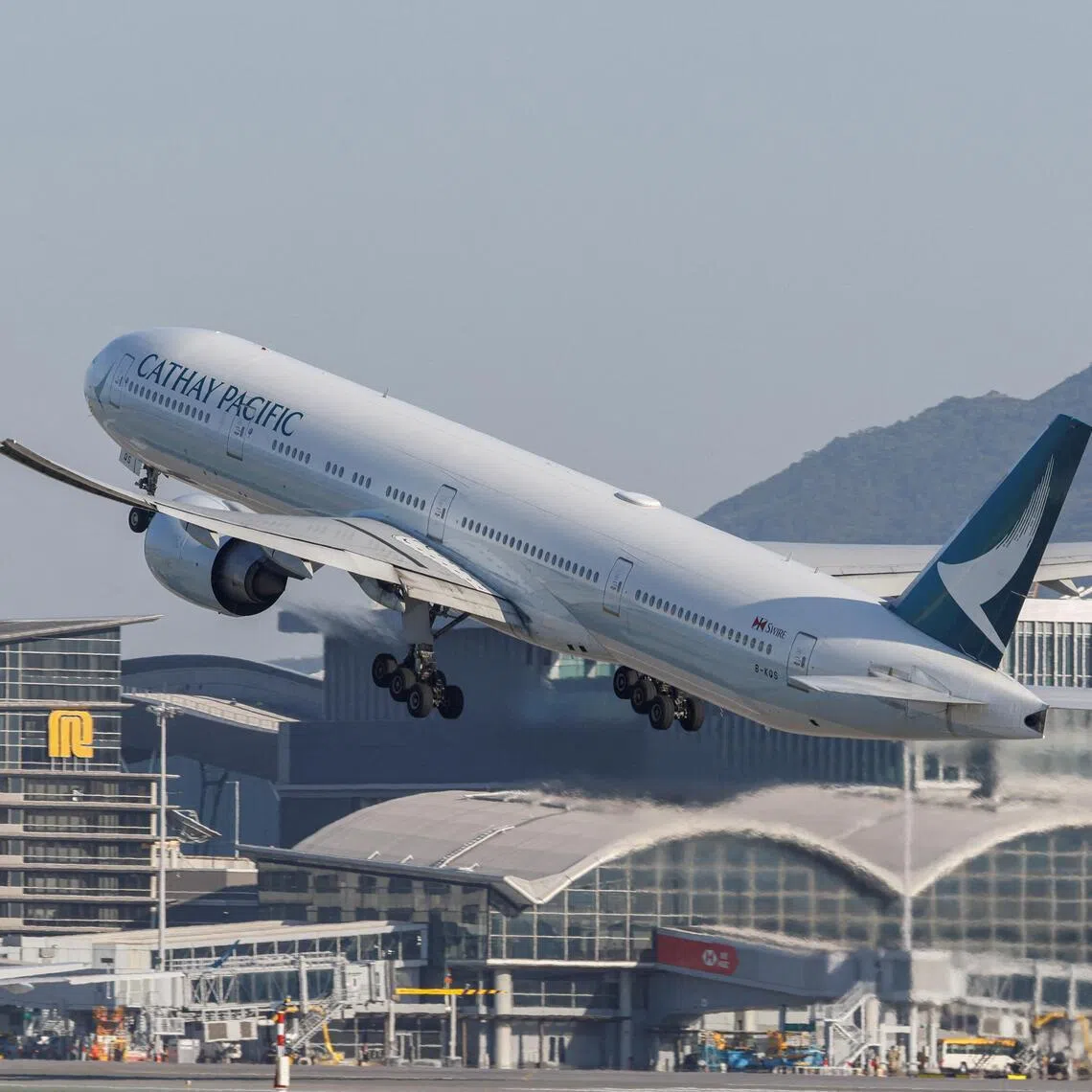 A Cathay Pacific aircraft takes off at Hong Kong International Airport on the day of the official launch of its third runway, in Hong Kong, China November 28, 2024.\
