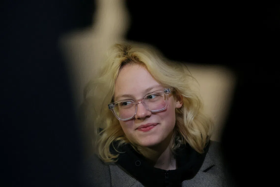 Diana Loginova, an 18-year-old street musician performing under the name Naoko with her band Stoptime, who was detained after publicly performing songs banned by the Russian government and songs by artists designated as 'foreign agents', waits before a court hearing in Saint Petersburg, Russia October 29, 2025. REUTERS/Anton Vaganov