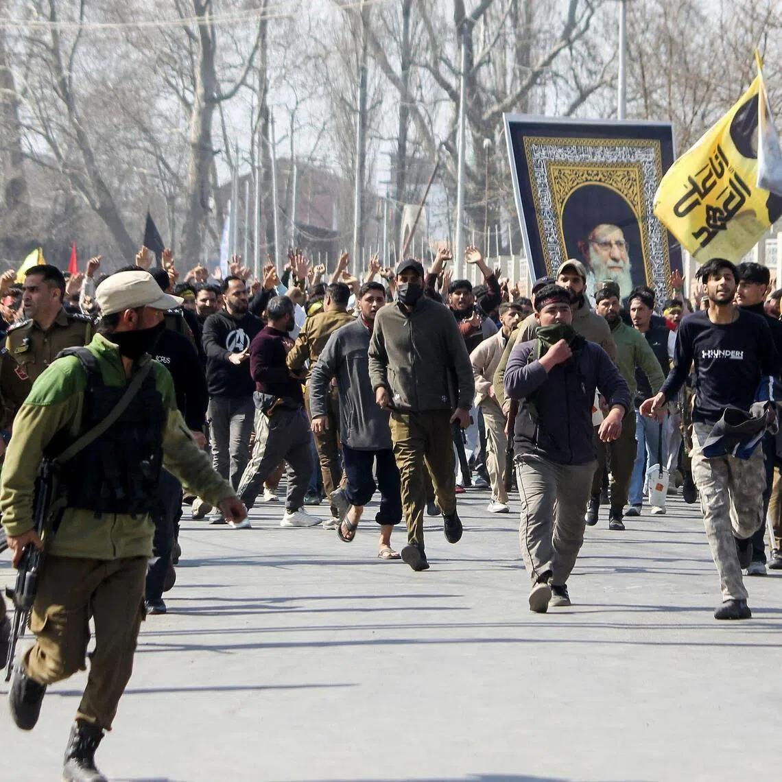 Protesters hold a portrait of Iran's late supreme leader Ayatollah Ali Khamenei in Srinagar on March 2, 2026.
