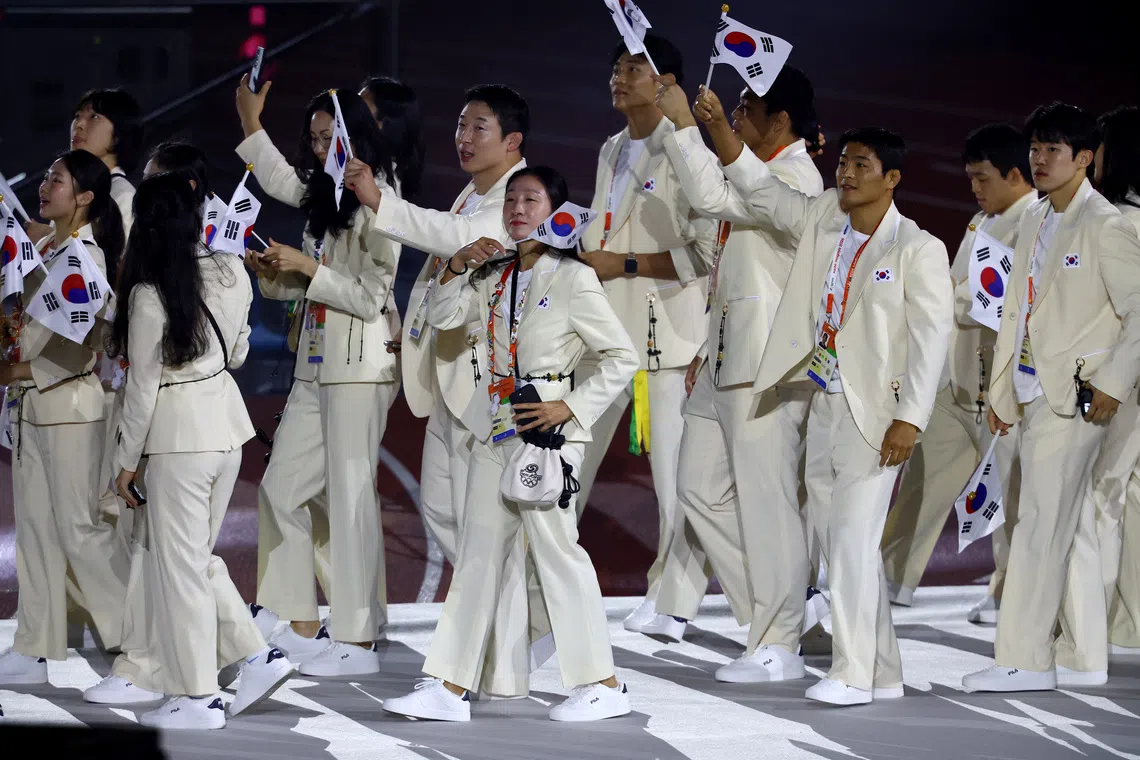 South Korean athletes at the closing ceremony of the Asian Games on Oct 4. There was public backlash after footballers celebrated military exemptions for winning gold at the Games.