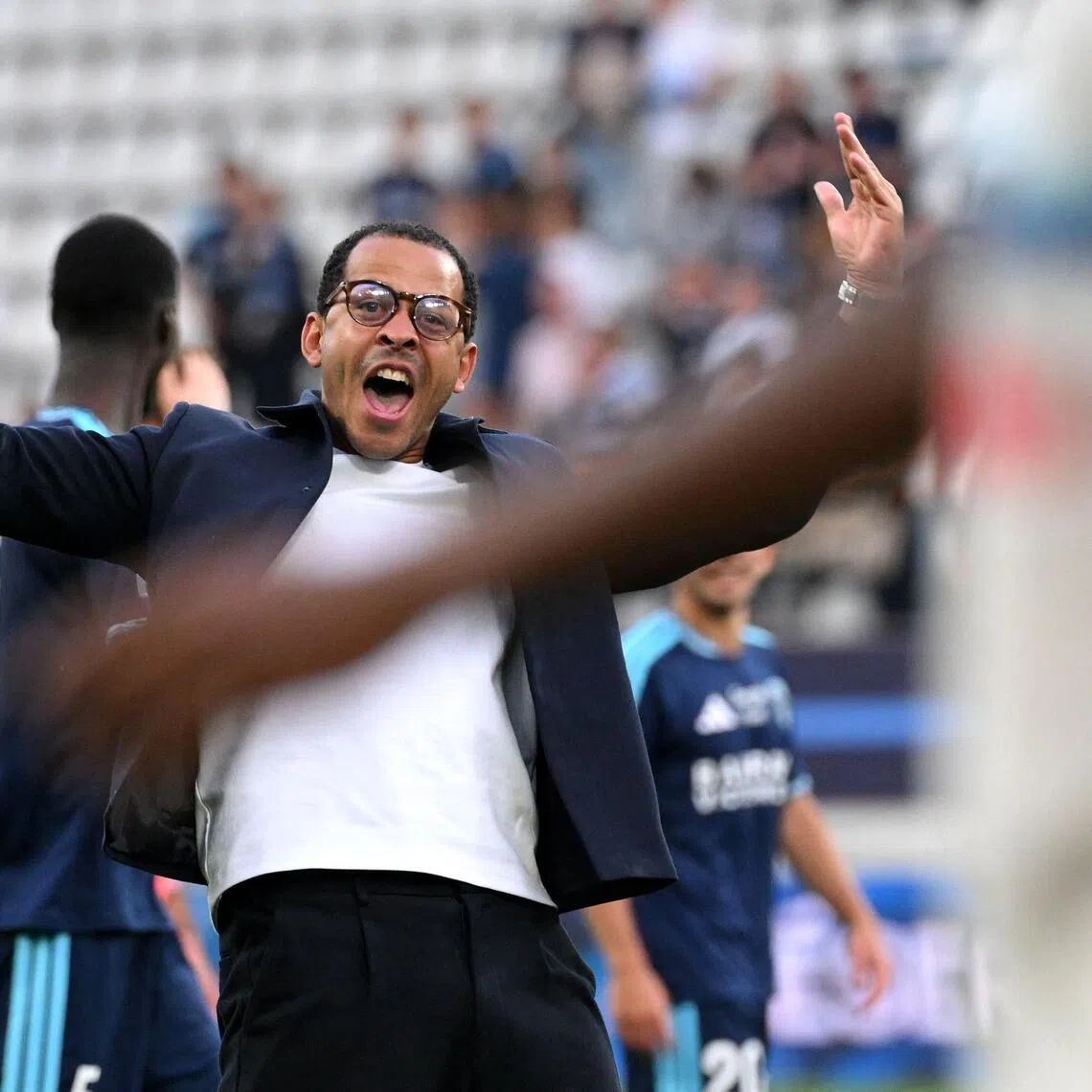 Paris FC’s English head coach Liam Rosenior reacts in front Strasbourg’s supporters at the end of the French Ligue 1 football match between Paris FC and RC Strasbourg on Sept 19.