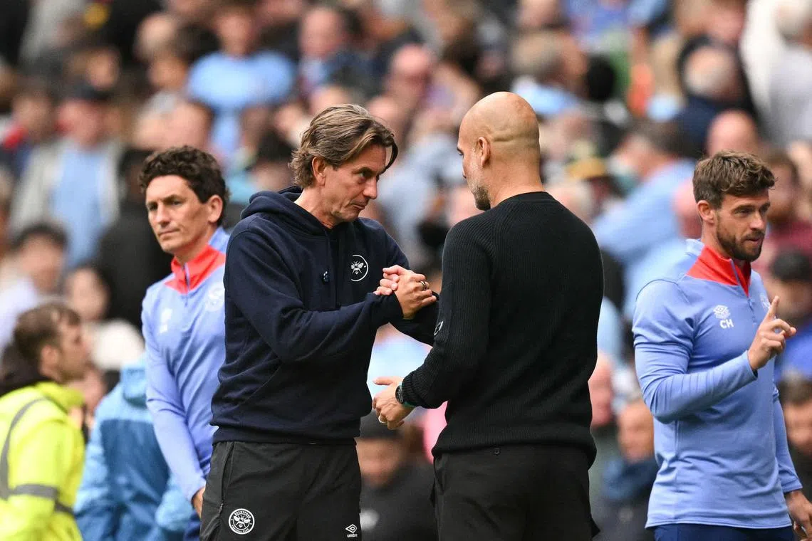 Brentford manager Thomas Frank and his Manchester City counterpart Pep Guardiola shake hands after the match.