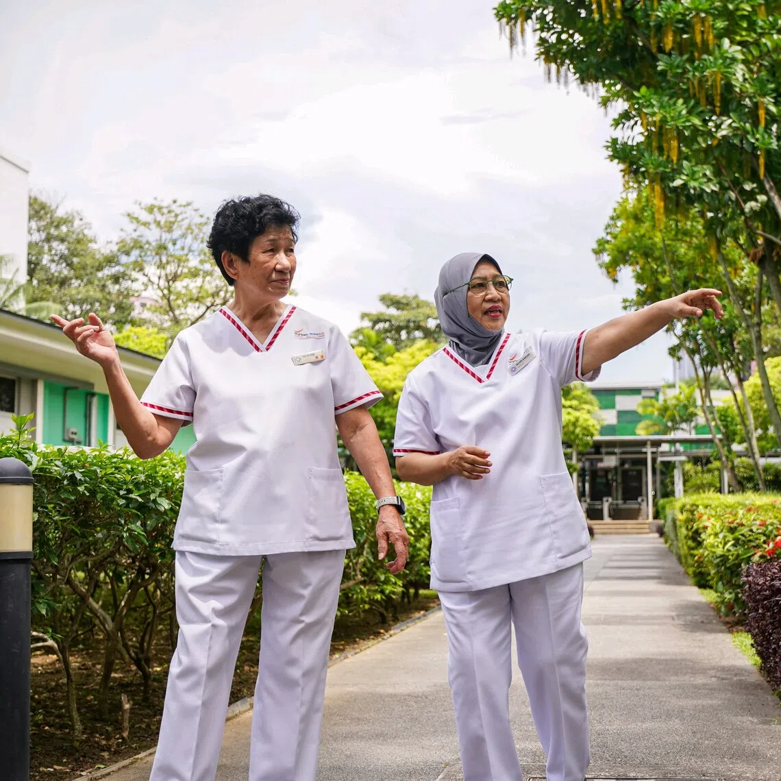 Ms Too Ah Kim (left), a senior midwife at what is now KK Women’s and Children’s Hospital, and Ms Saleha Kamsan, a staff midwife at the hospital.