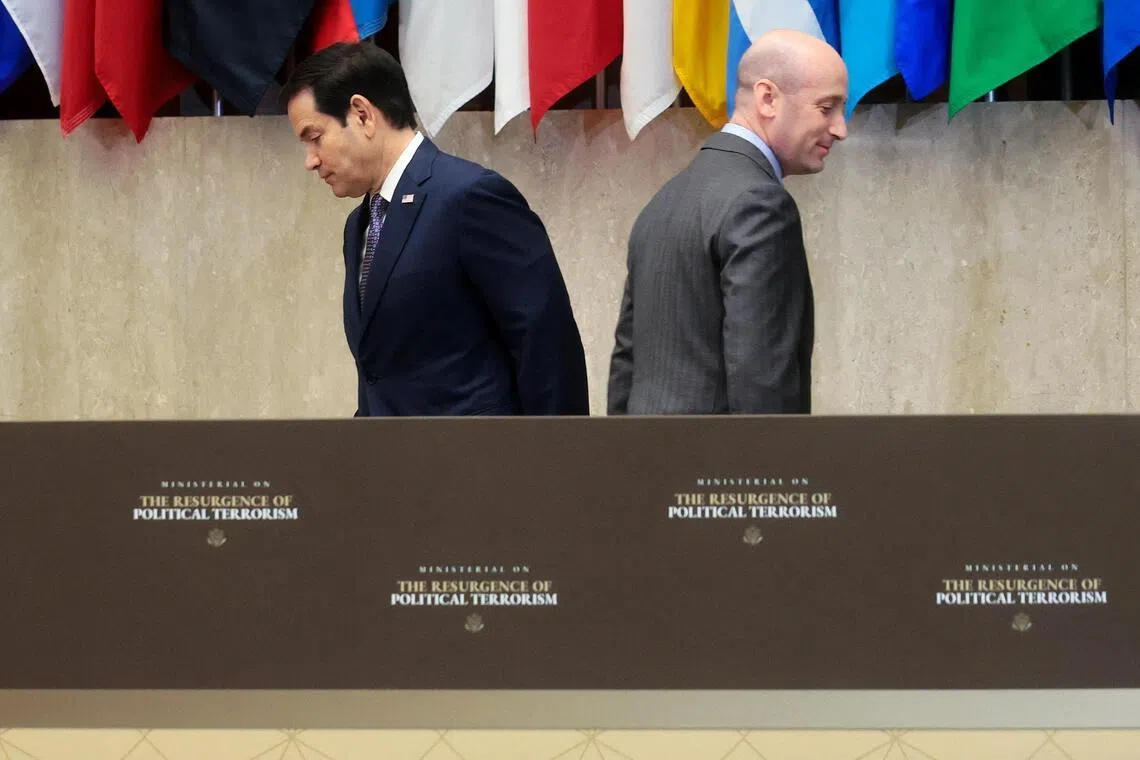 US Secretary of State Marco Rubio (left) crossing paths with fellow speaker and White House deputy chief of staff Stephen Miller at the State Department event on July 16.